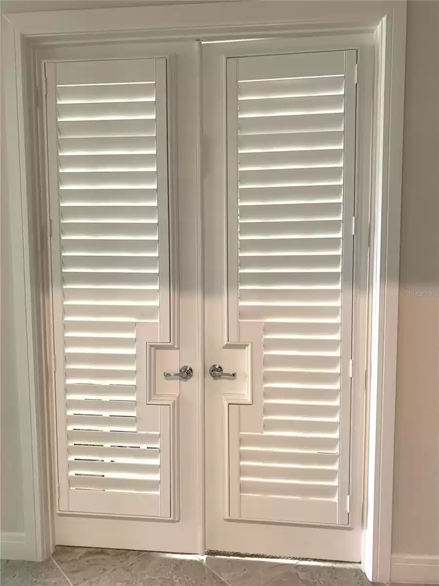 Dual French doors to bedroom3/den/office