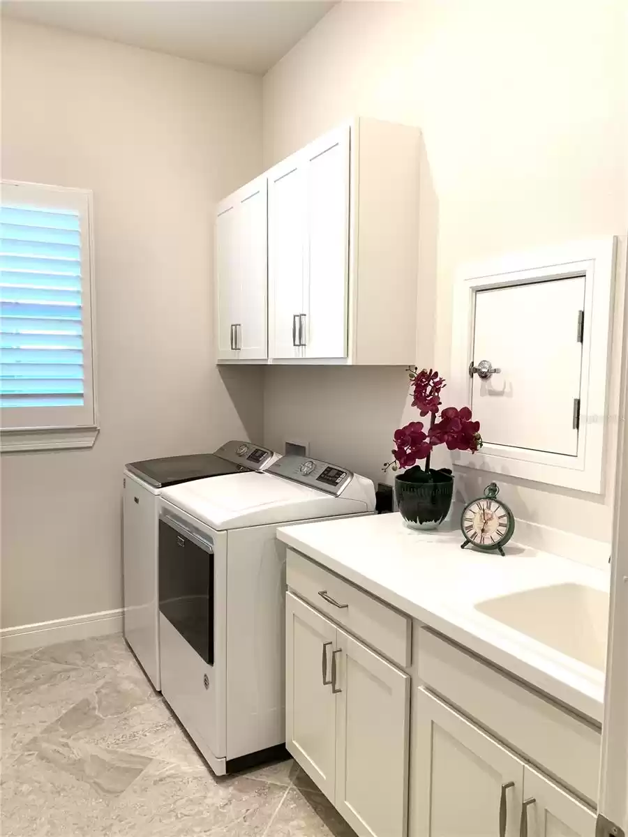 Laundry room with sink and cabinet upgrade