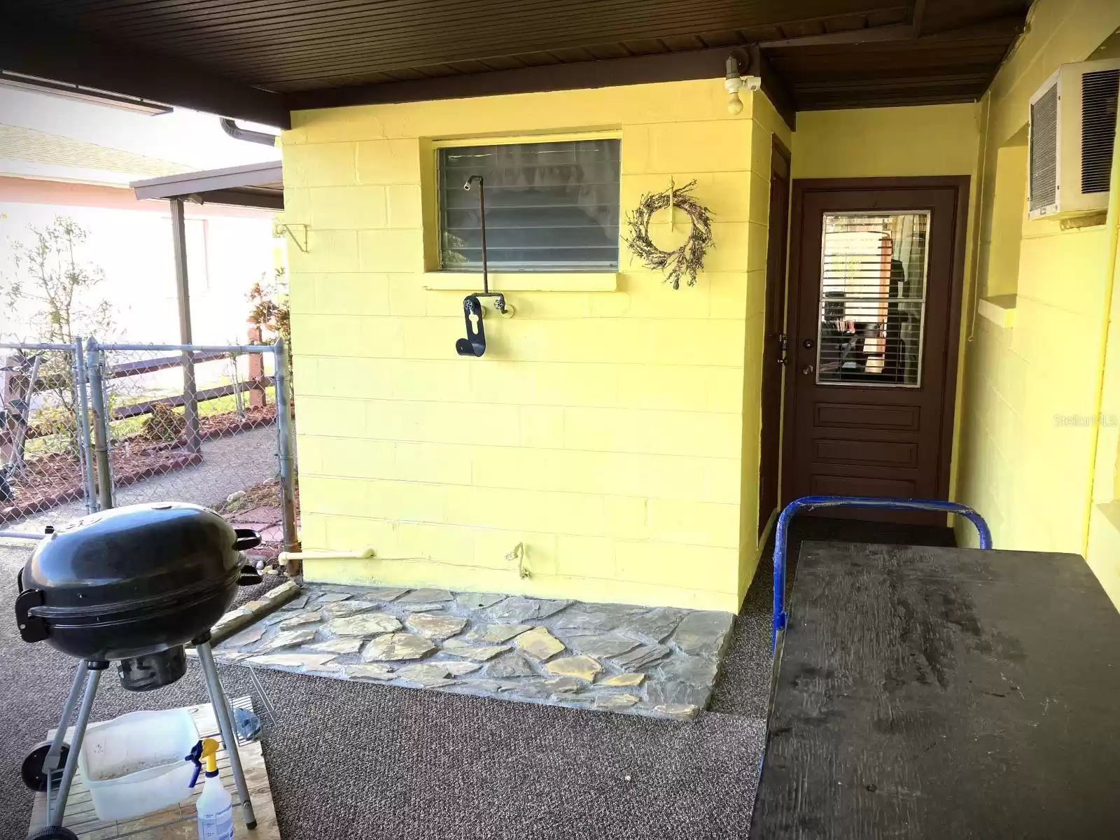 Covered porch- BBQ - outdoor shower area view 2