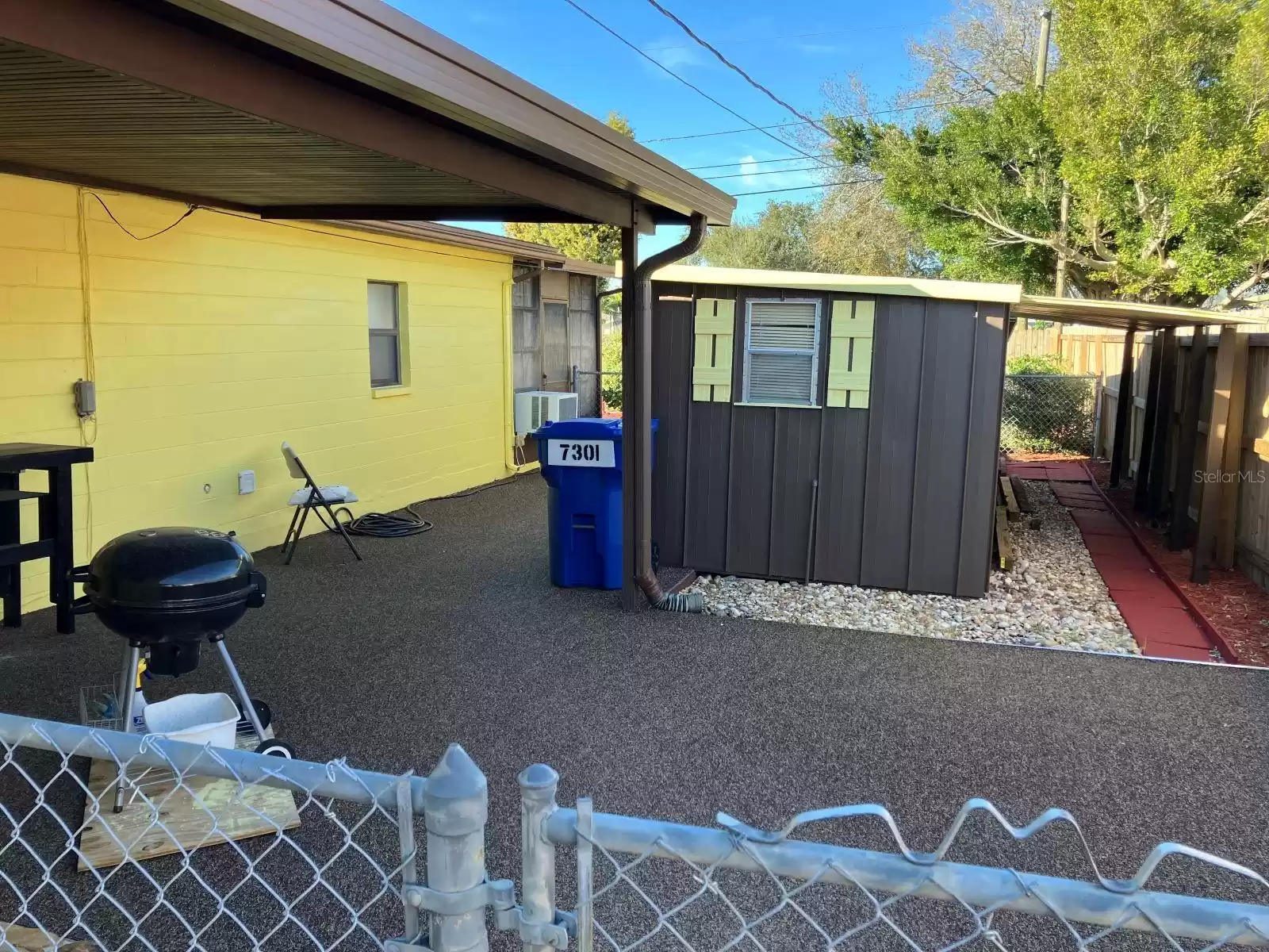 Large Shed showing extra cover storage area