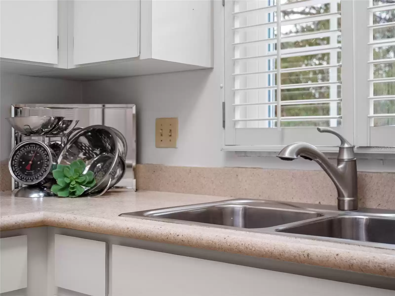 Kitchen - windows over the sink with shutters