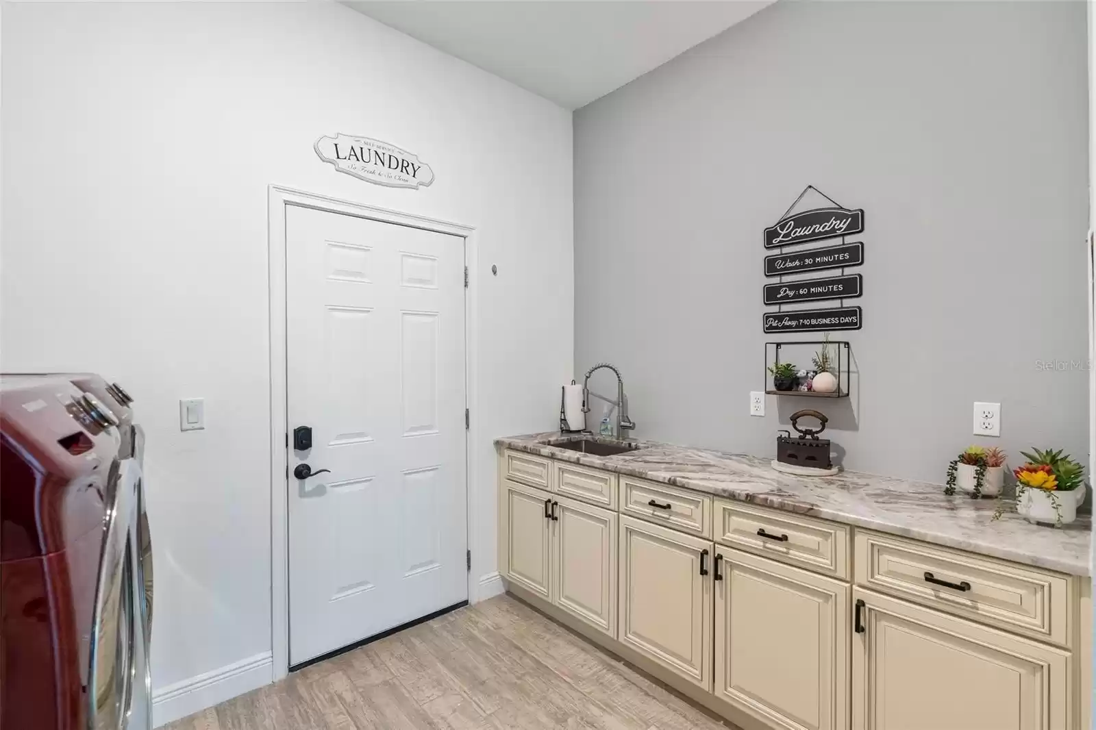 Huge Laundry Room with Samsung Front-Load Washer and Dryer