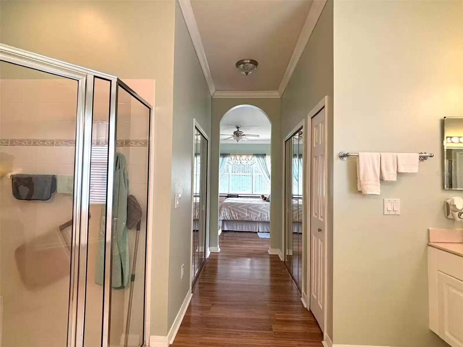 Primary Bathroom hall- double walk-in closets with mirrors