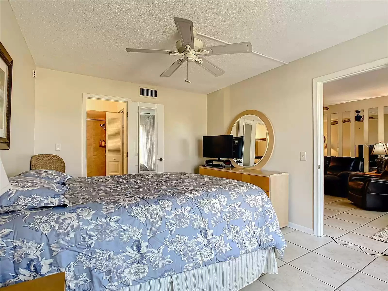 Master bedroom with living room to the right and the master bathroom in left background.