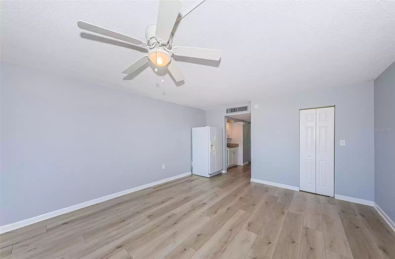 Surprisingly large walk in closet behind bifold doors