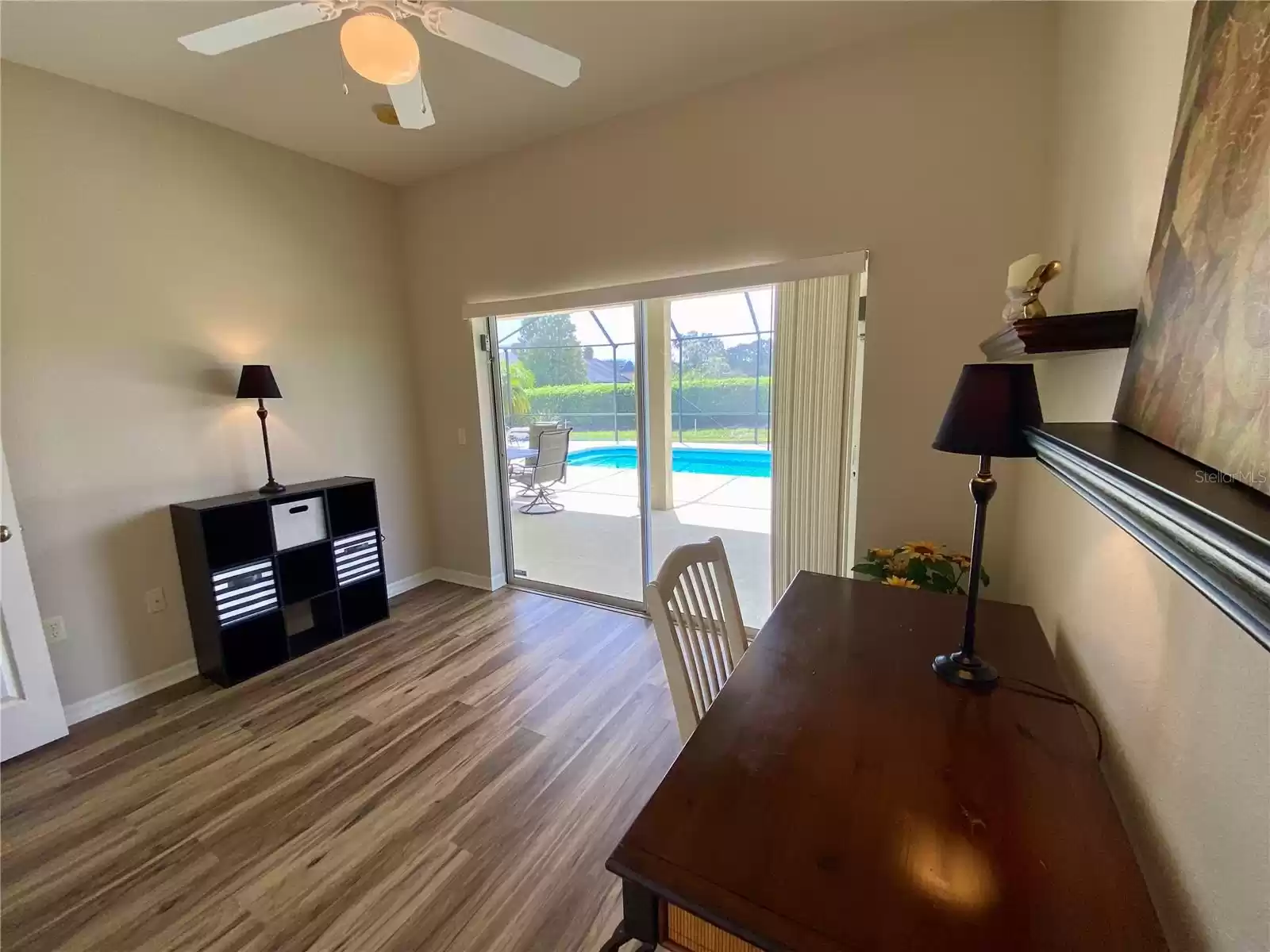 3rd bedroom or office with sliders to pool and lanai