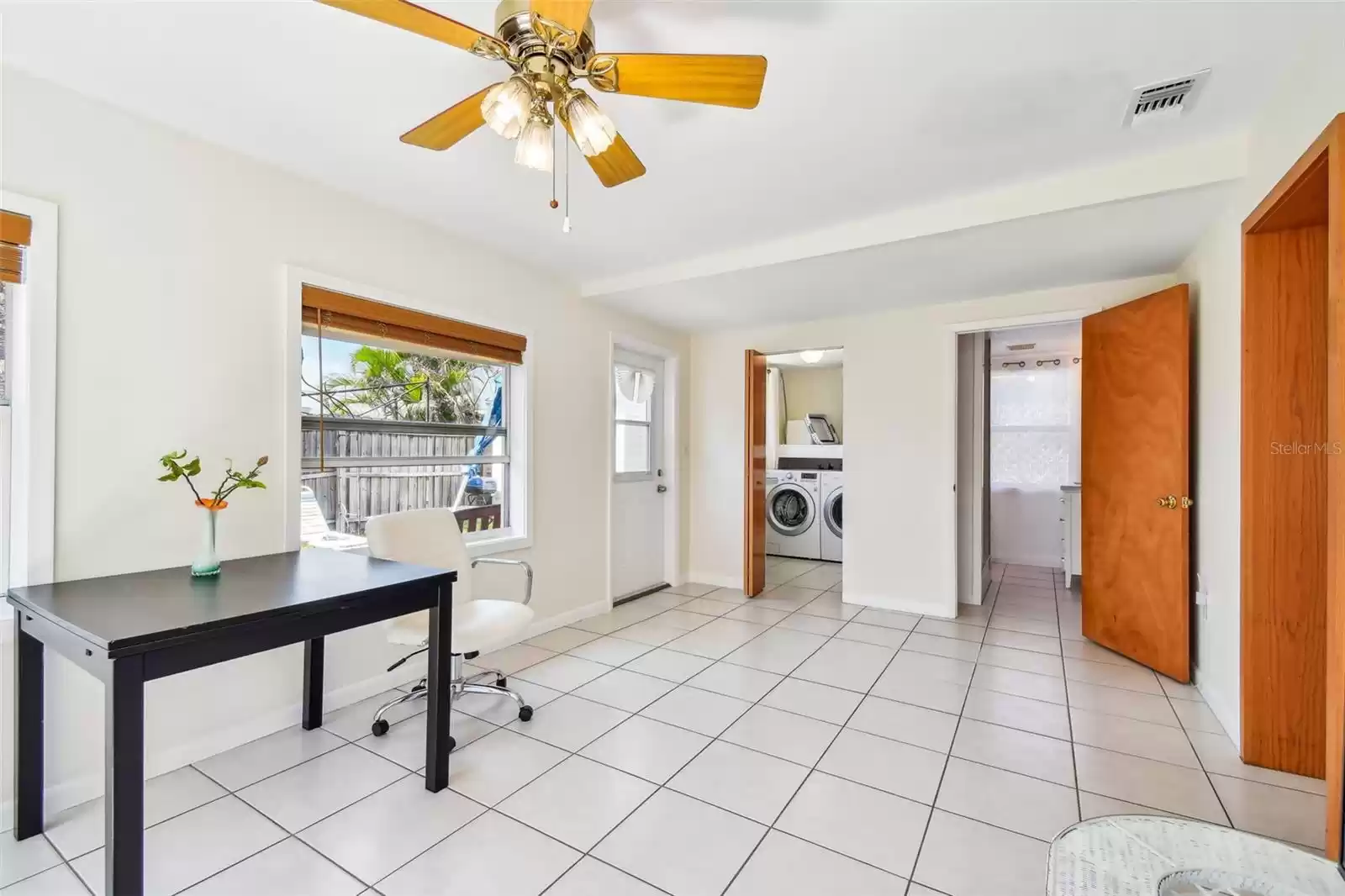 Florida room connected to the laundry room and guest bathroom