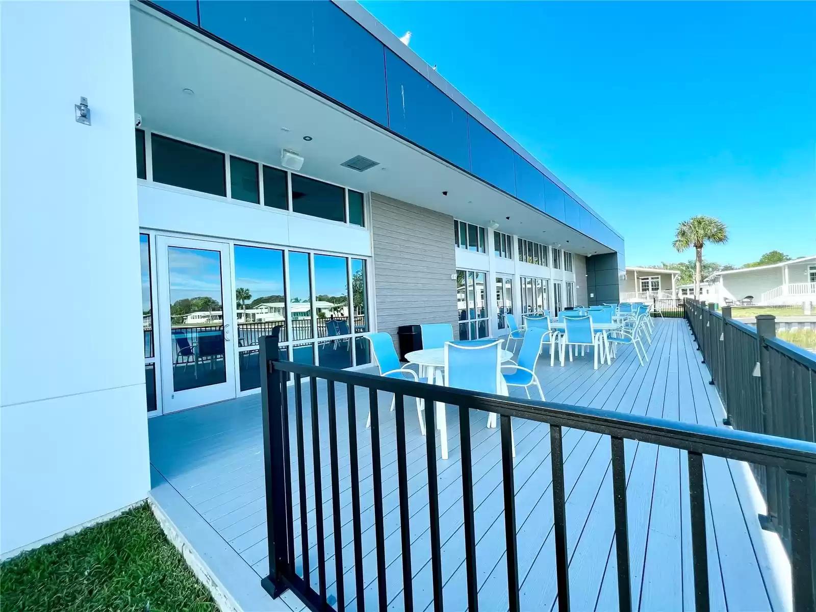 Open patio in back of clubhouse overlooking half moon lake