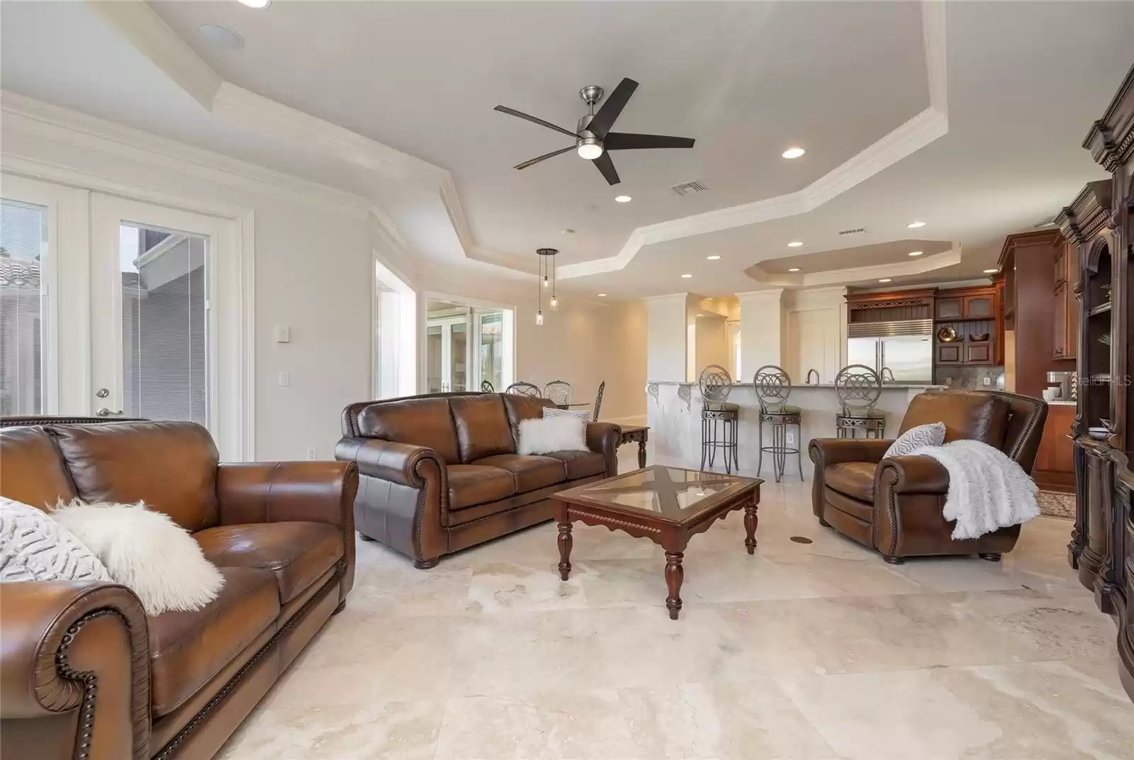 Family room doors open to the pool area.