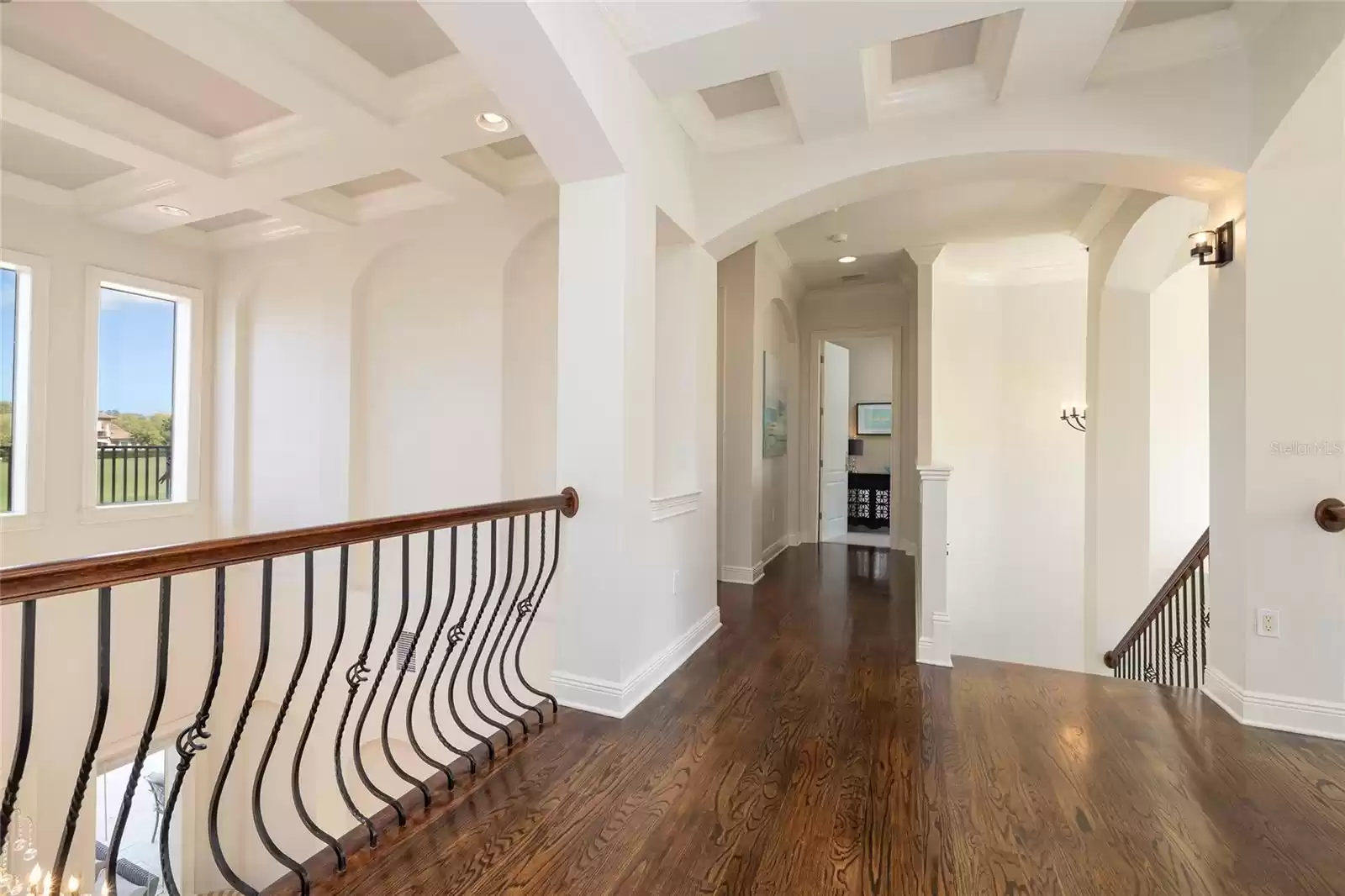 Bridge overlooks the living room, dining room, and foyer.