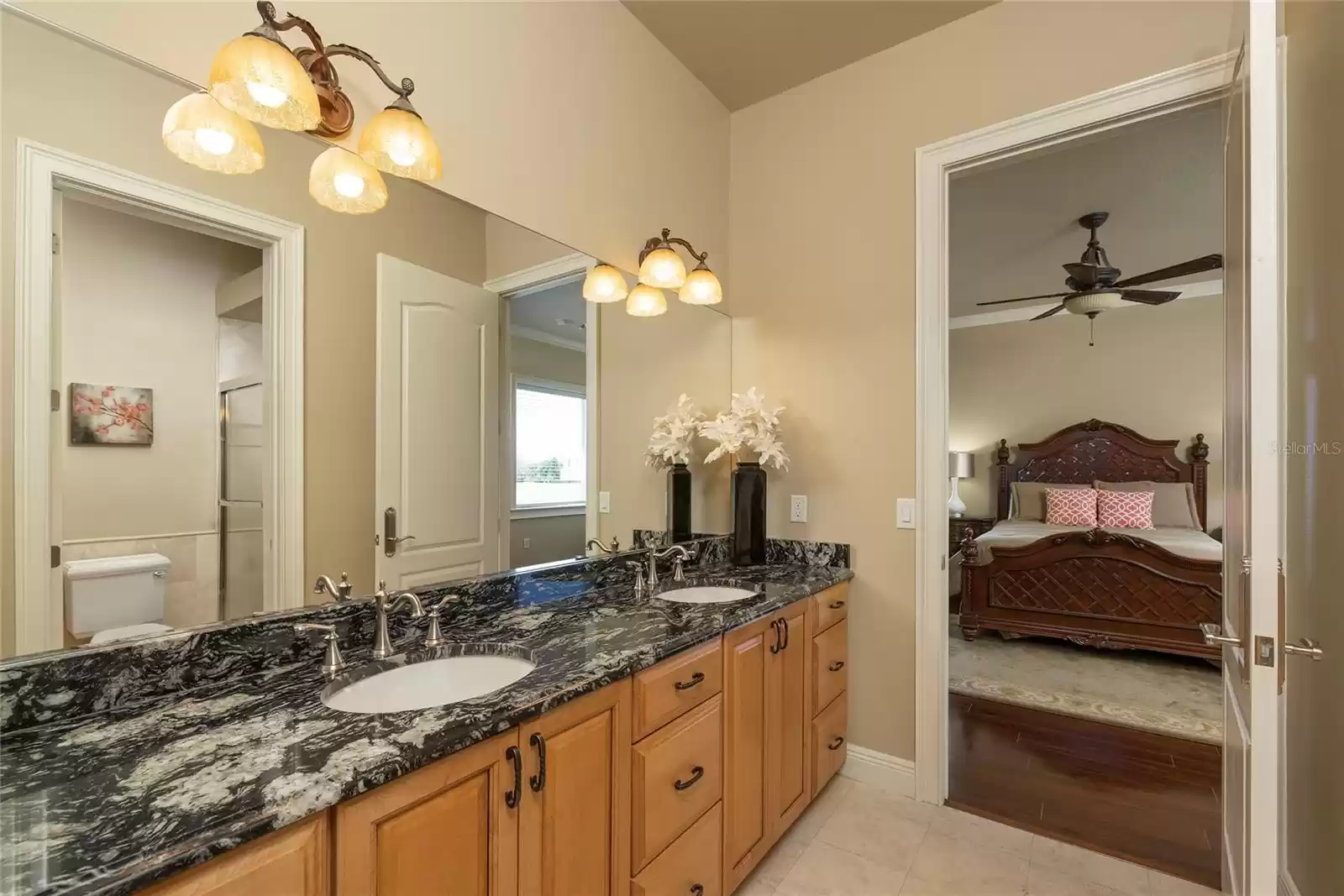 Jack n Jill bath with two sinks and private shower/commode enclosure.