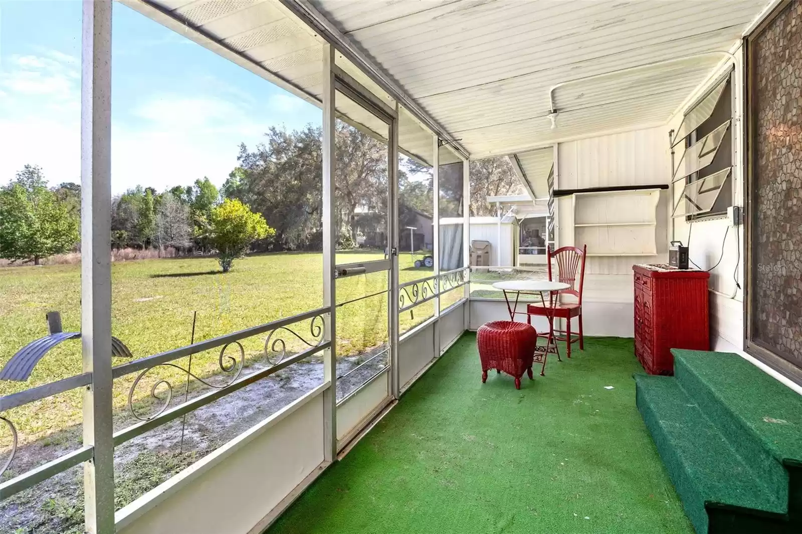 Screened in back porch on 1973 home.