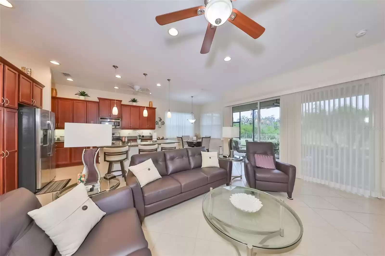 Porcelain tile, for easy care, is throughout this open living space and the multiple sliding glass doors are perfect when you want to open the house and feel the sea breezes!