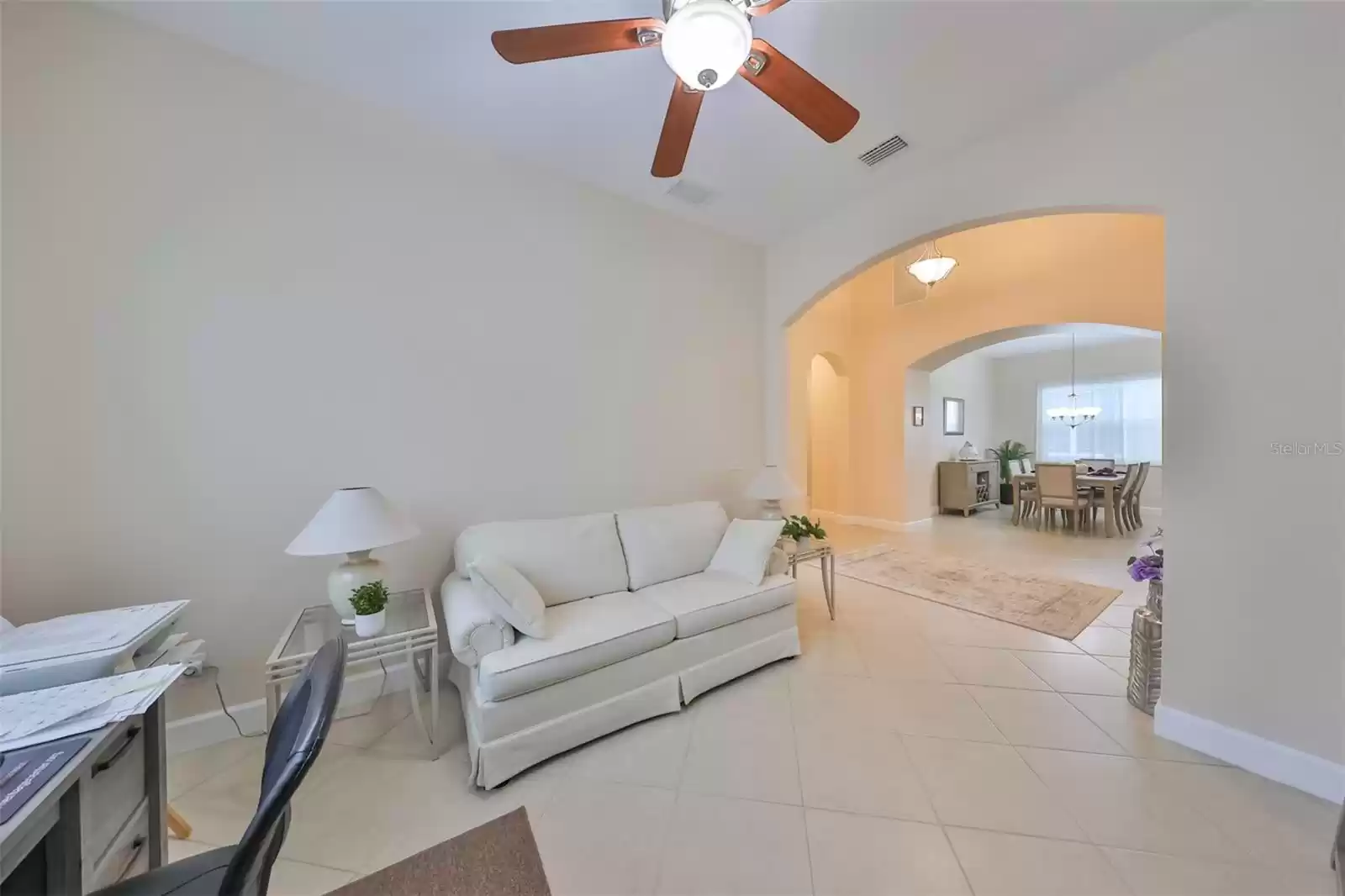 Porcelain tile, placed on the diagonal, is just another example of the construction quality of this home, along with arched doorways and high ceilings.