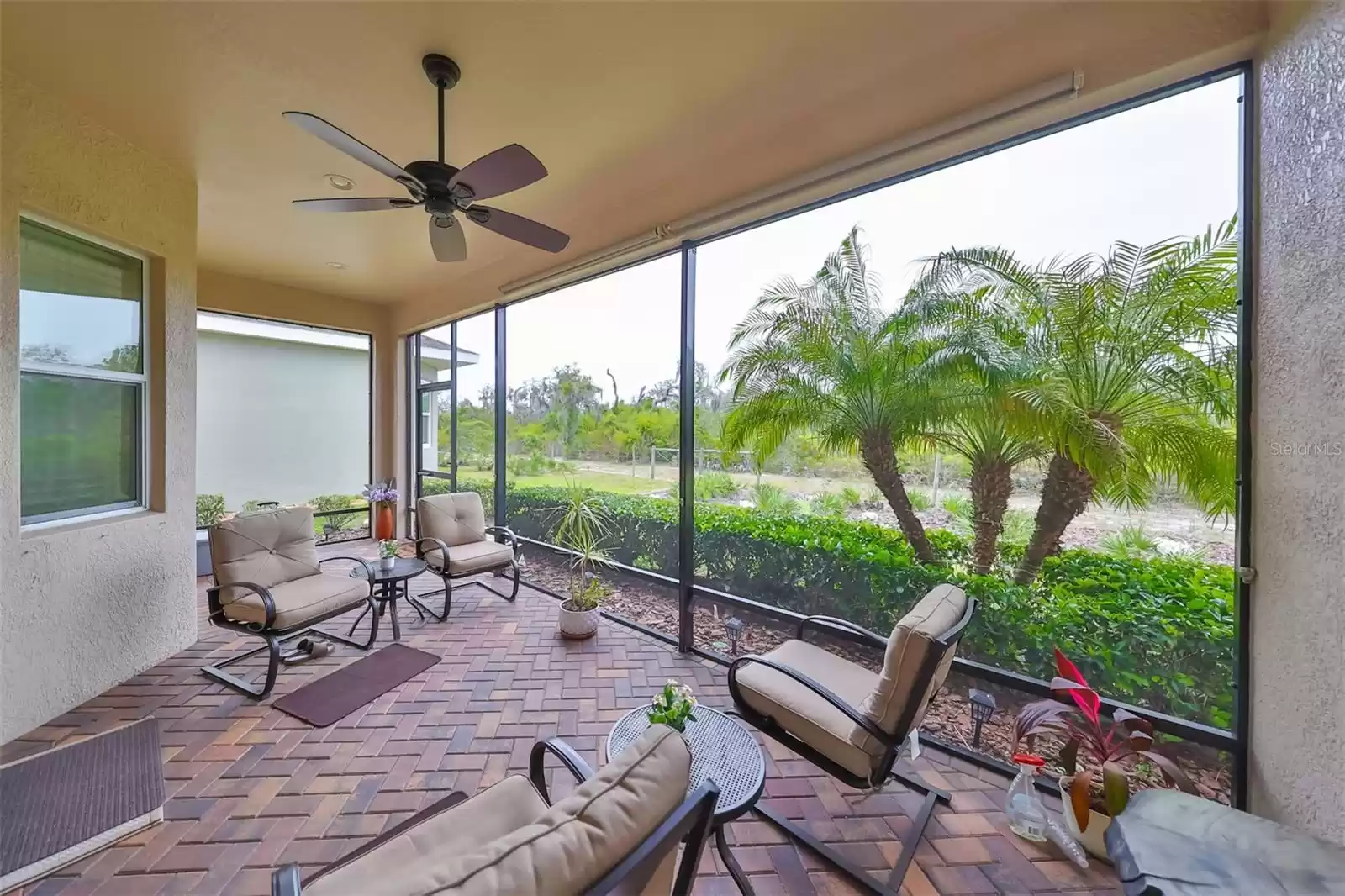 The lanai has ceiling fan, custom brick pavers and is enclosed so that you can enjoy this space all year round!