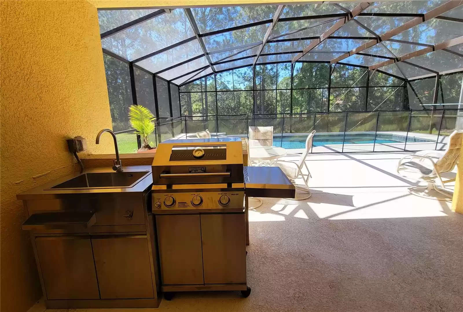 Brand new stainless steel sink and natural gas grill!  Enhanced outdoor kitchen ambience!