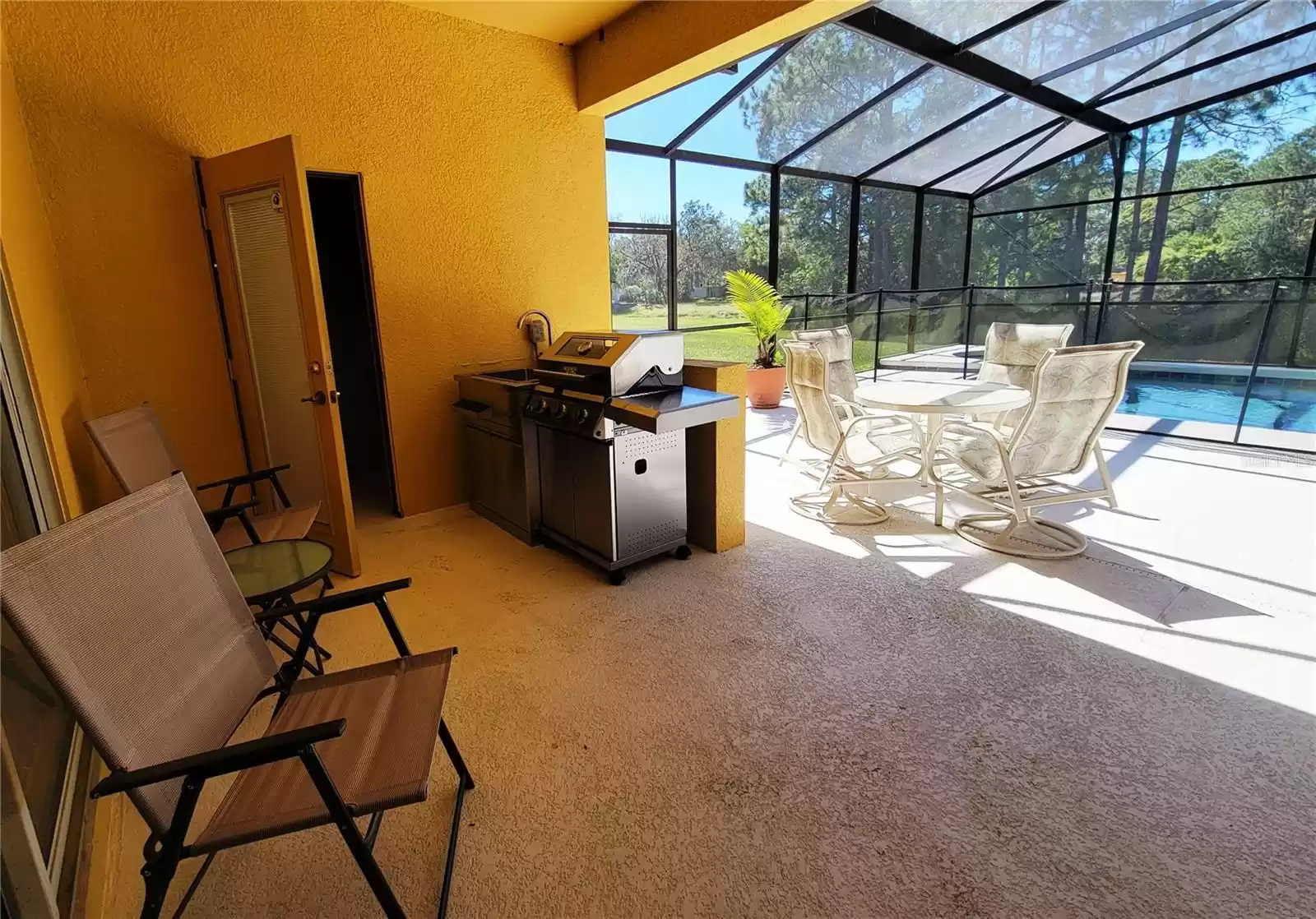 Pool area features an outdoor half bath