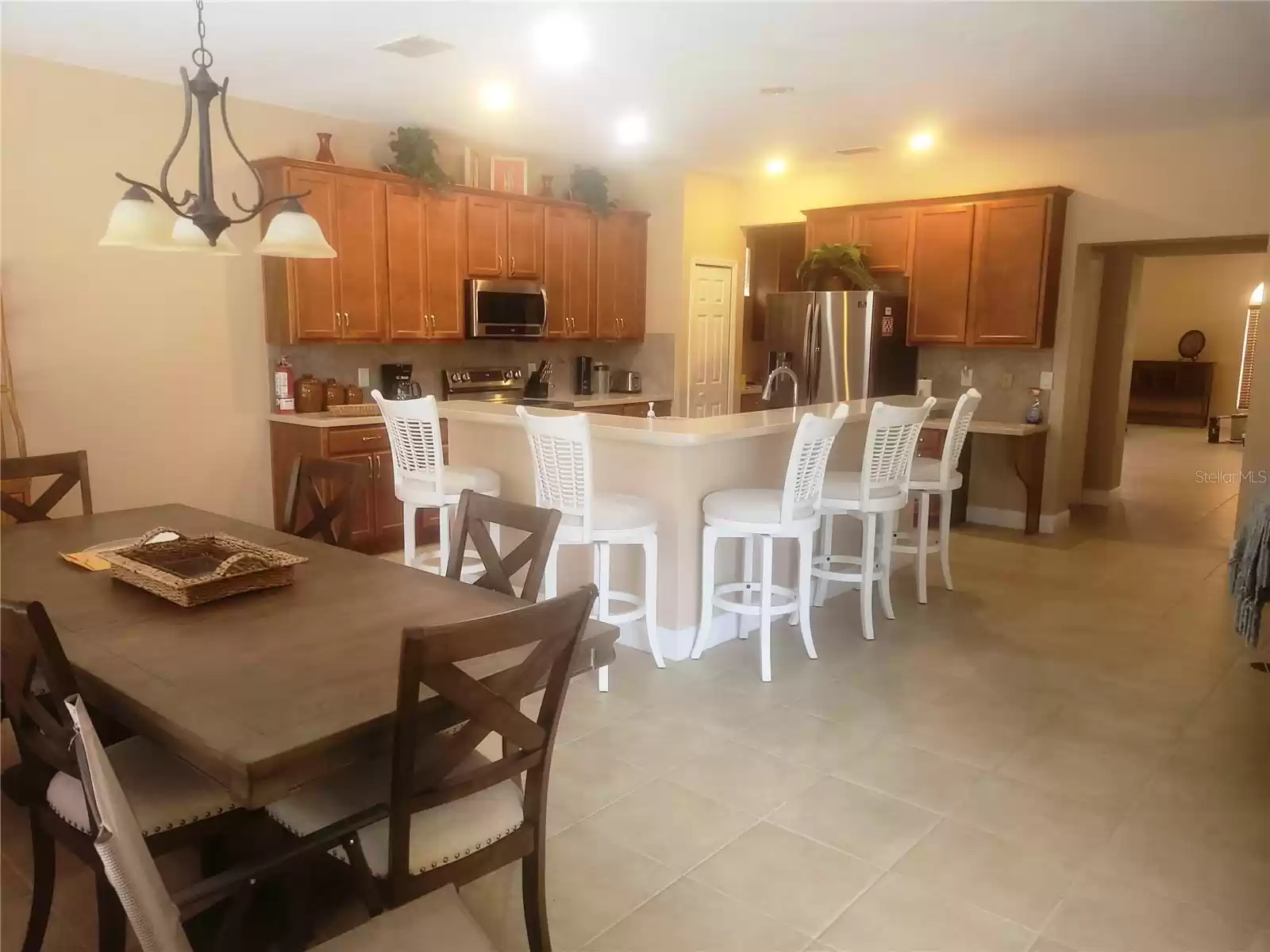 Large, modern kitchen area.  Newer stainless steel appliances.  Table and all chairs included.