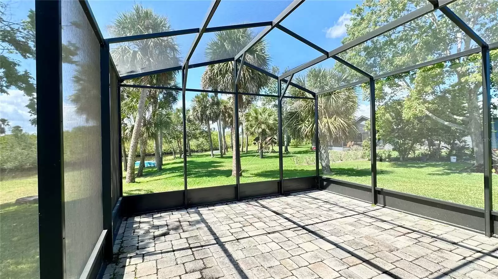 Screened in Porch overlooking backyard and Canal!