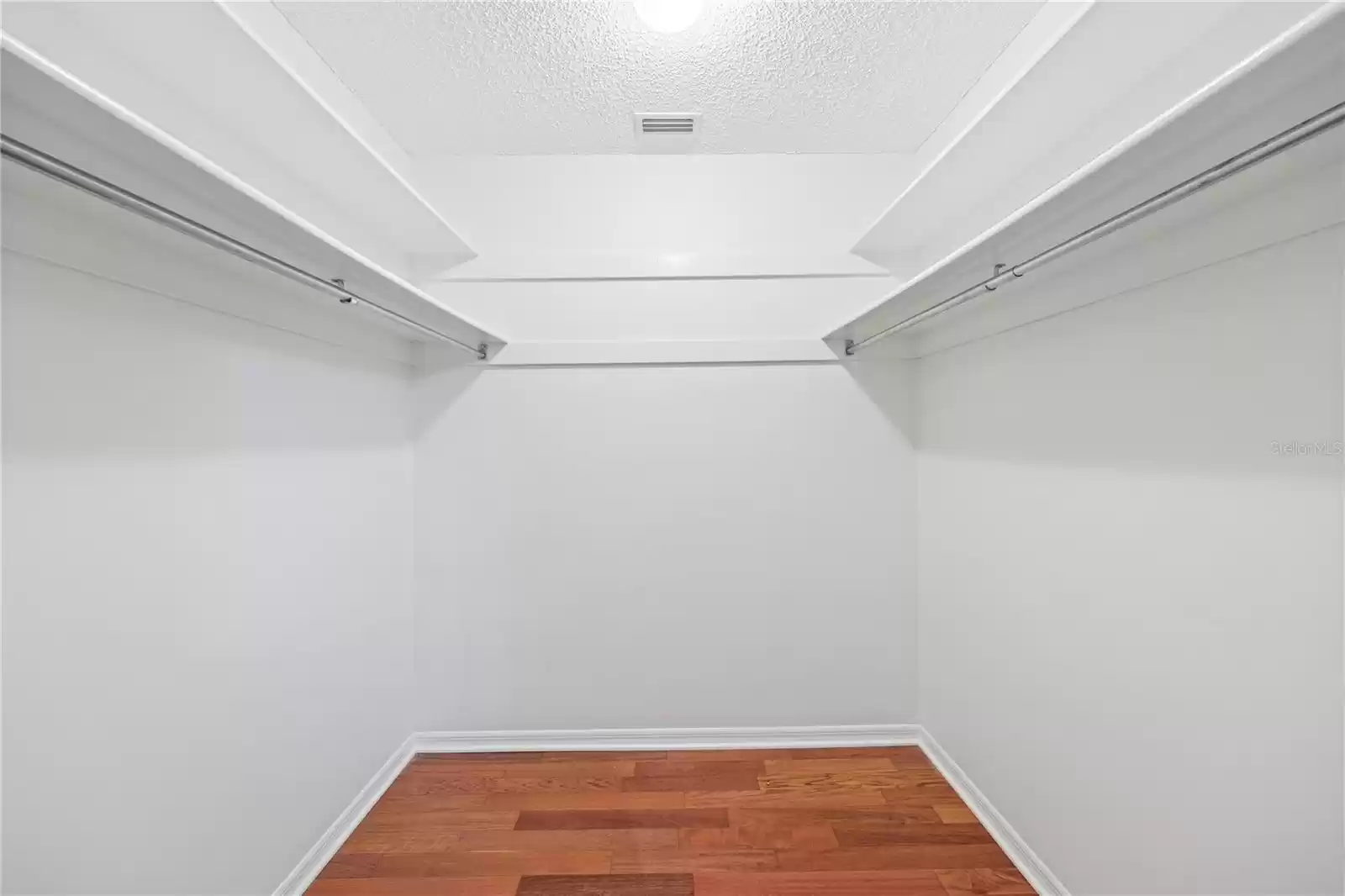 Primary walk-in closet.