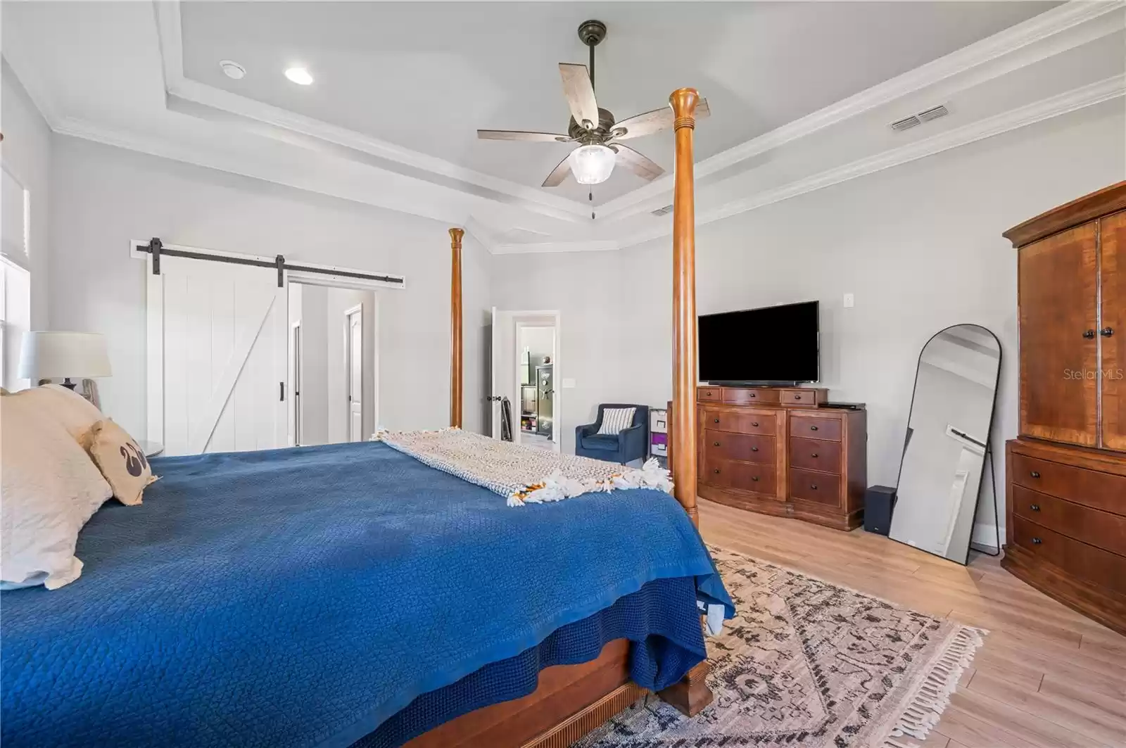 Primary Bedroom with french doors to pool and Lake views!