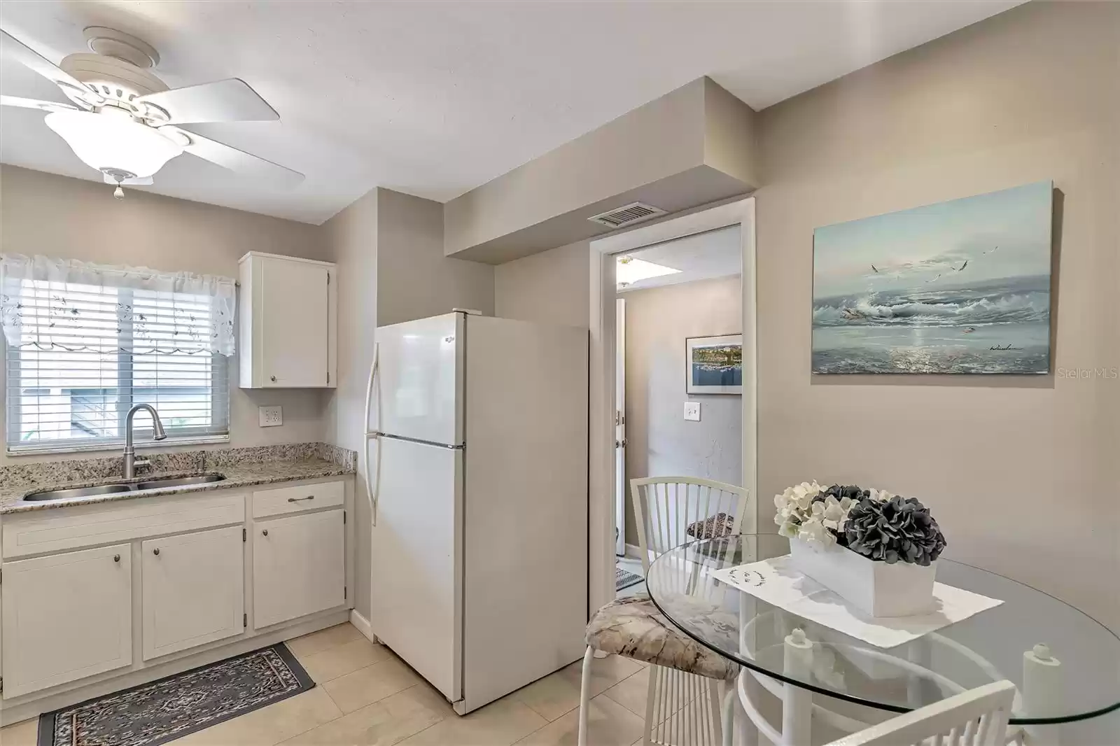 Kitchen with granite counters and room for a table