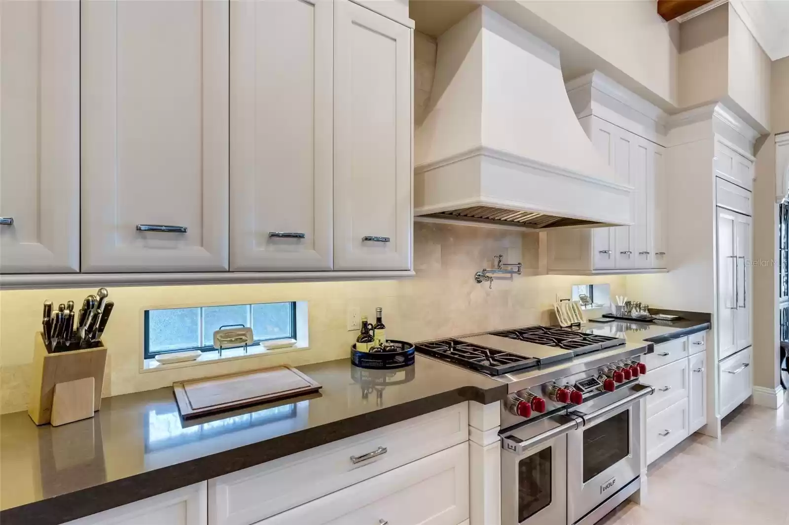 Under cabinet lighting, designer cabinet pulls for a sleek finished look.