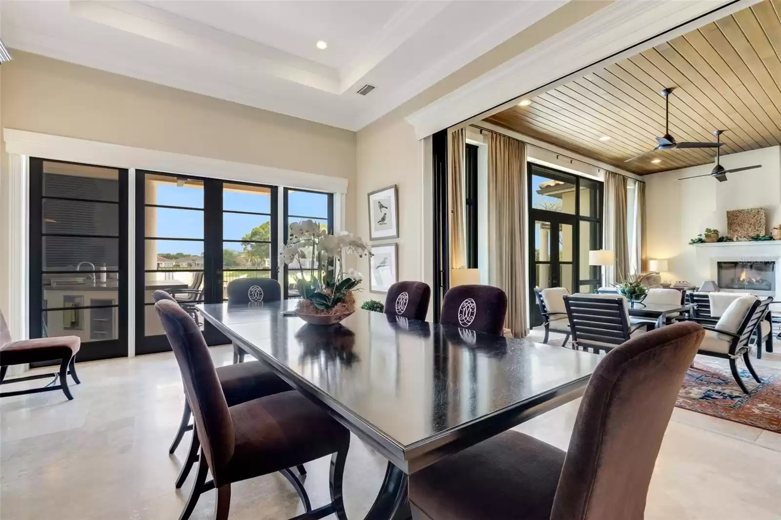 Opening to both the main living area and to the covered lanai and summer kitchen.