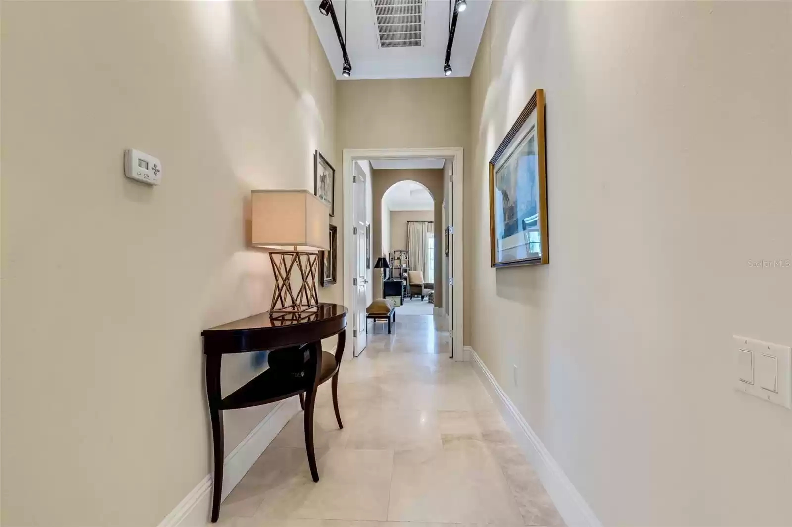 Down this wide gallery style hallway and beyond the double doors