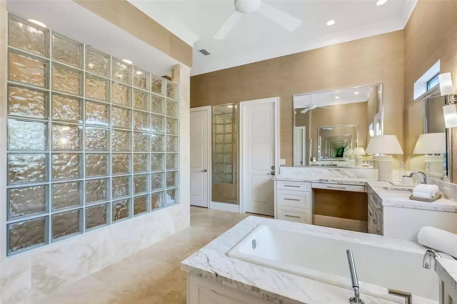 The shower enjoys natural light through the beauty of classic glass block.