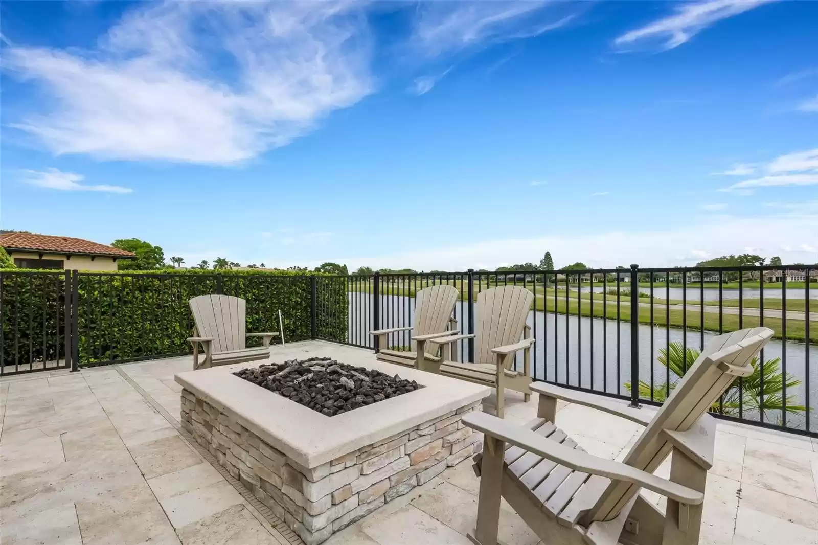 The outdoor living area is equipped just as lavishly from the oversized gas firepit.