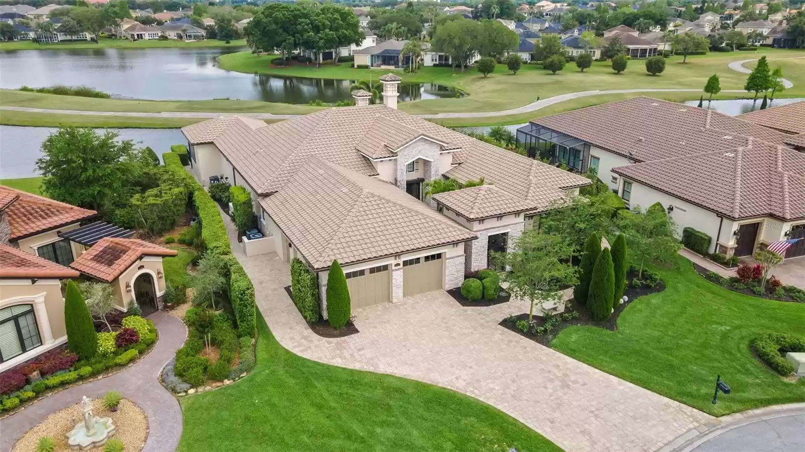 With barrel tile roofs throughout, paver stone driveway and unique exterior stone and iron treatments.