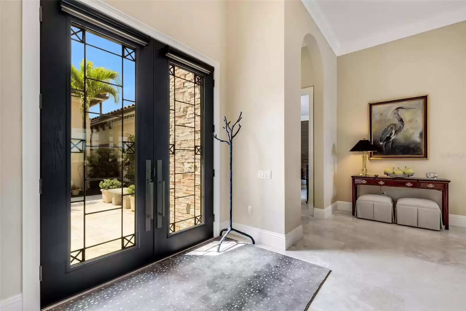 Step inside and you will instantly notice the gorgeous smooth travertine stone flooring..