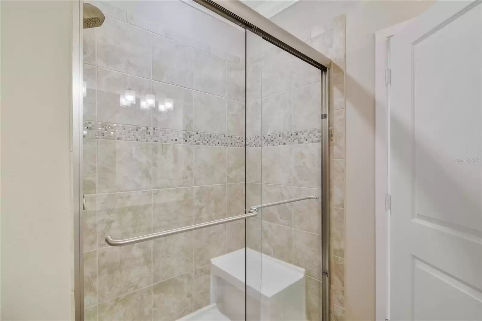 PRIMARY EN-SUITE WALK IN SHOWER WITH BENCH