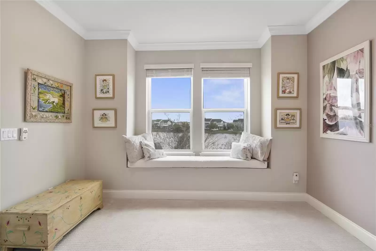 PRIMARY SUITE SITTING AREA overlooks POND.