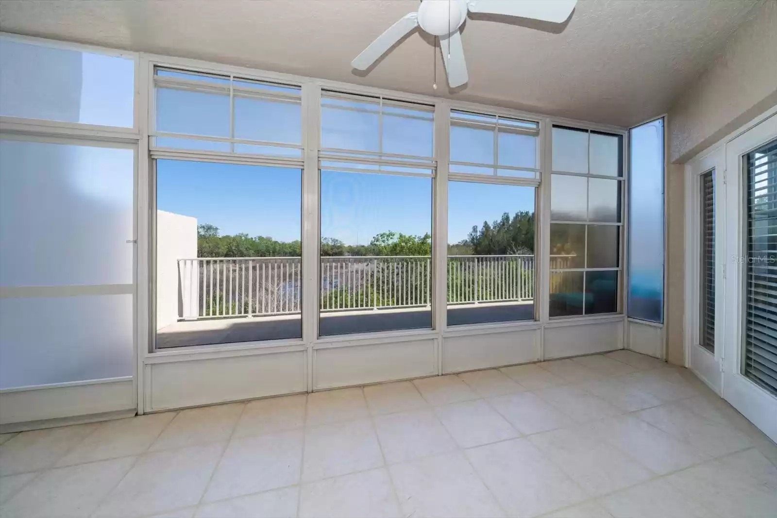 ALL WEATHER MULTI PURPOSE SCREEN ROOM.  PRIMARY BEDROOM ACCESS TO THE RIGHT THROUGH THE FRENCH DOOR.