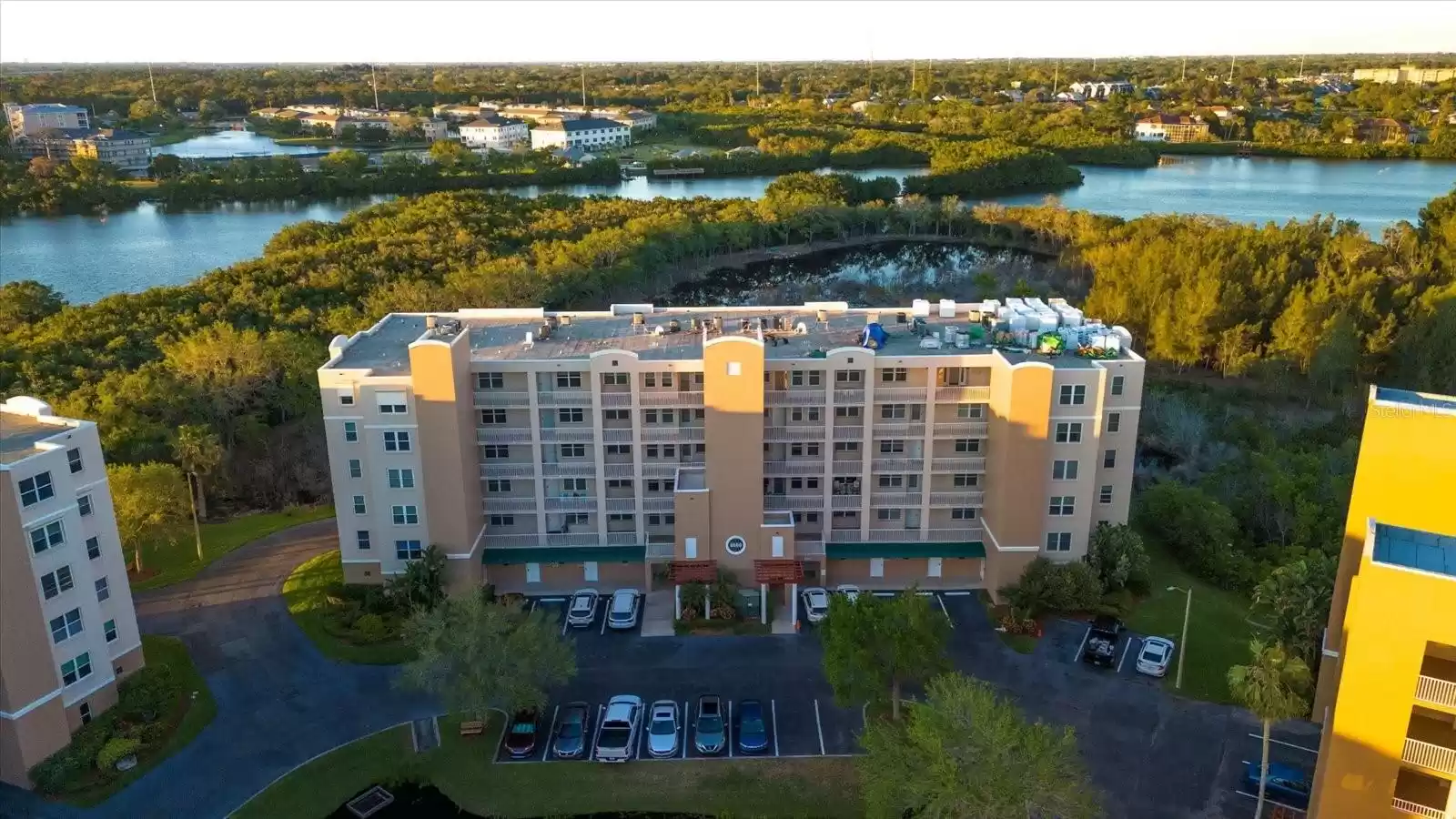 OWNER PARKING IS RIGHT IN FRONT OF THE BUILDING. ADDITIONAL PARKING IS JUST ACROSS FROM BUILDING. UNIT 7105 IS ON 1ST FLOOR JUST ABOVE GARAGES. TO THE RIGHT IN THIS PICTURE.