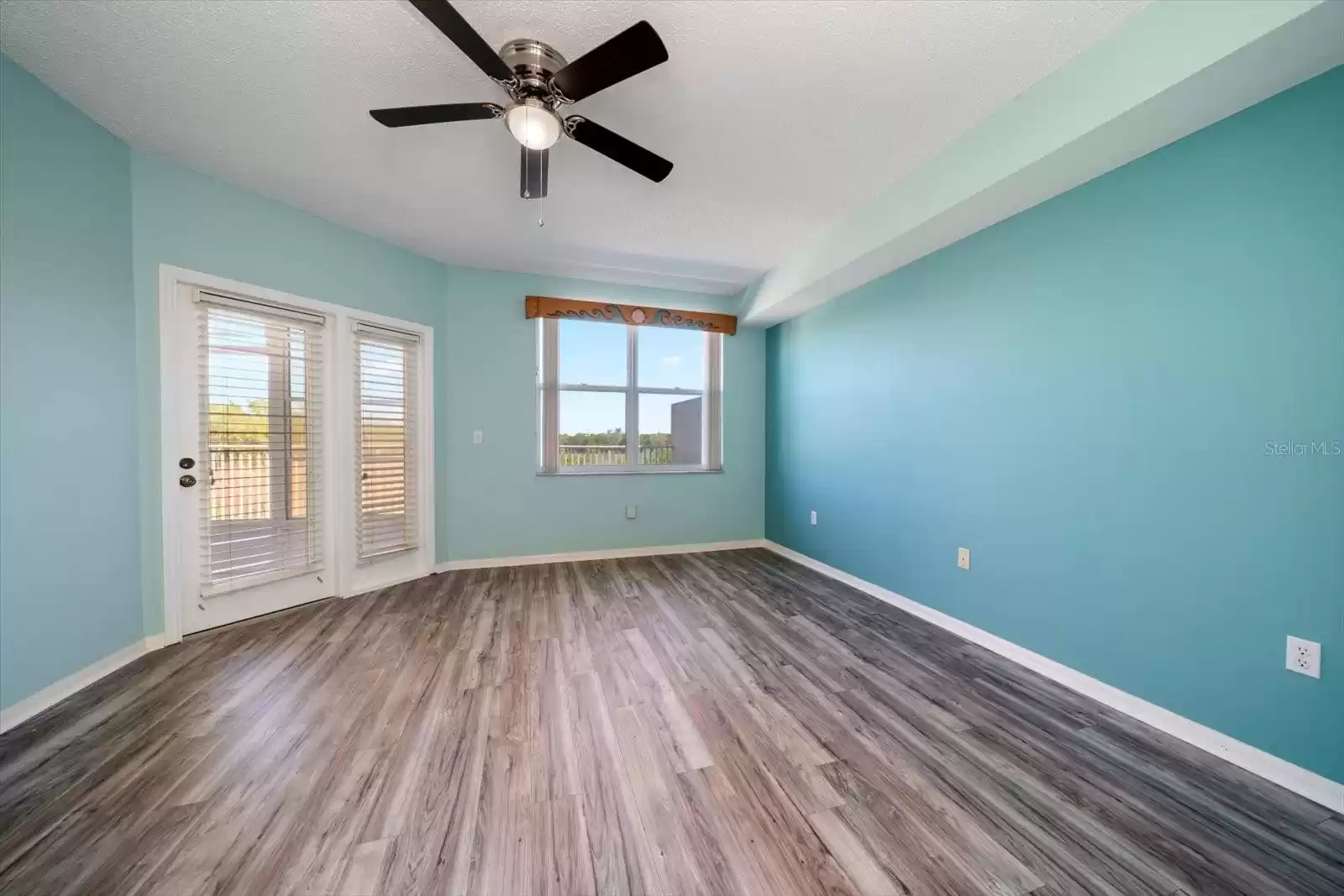 FRENCH DOOR TO OUTSIDE THROUGH SCREENED PATIO.