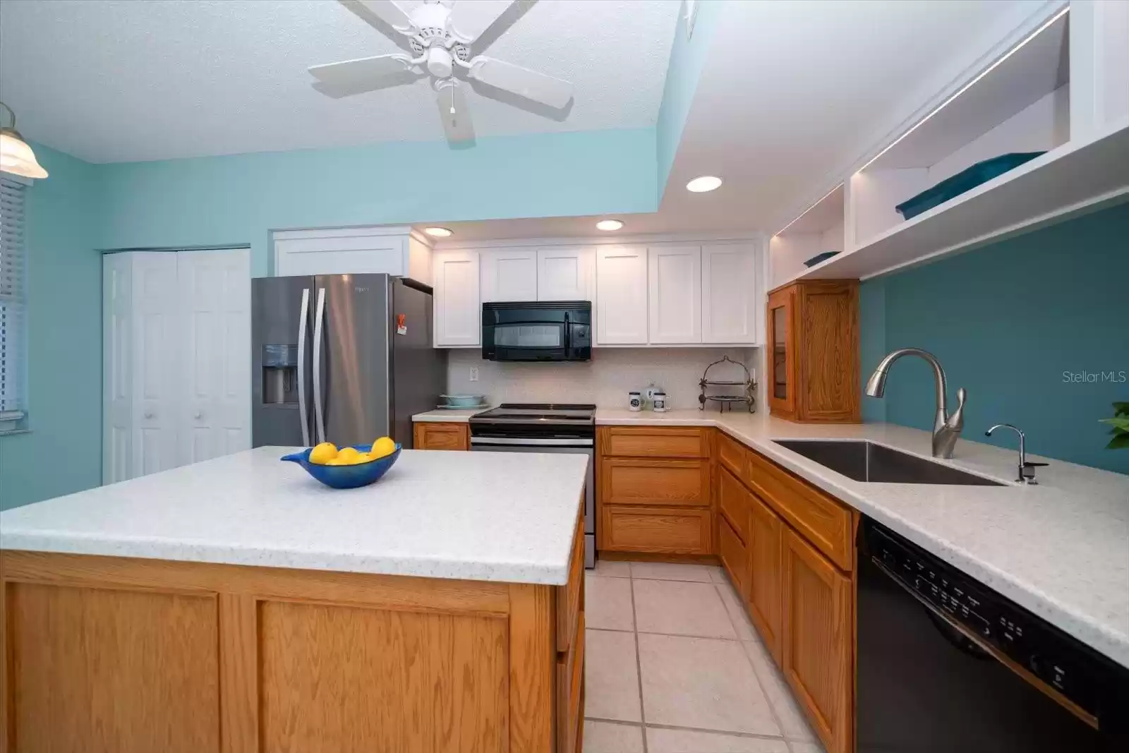 KITCHEN HAS A PANTRY. WHICH ALLOWS AMPLE SPACE FOR STORAGE.