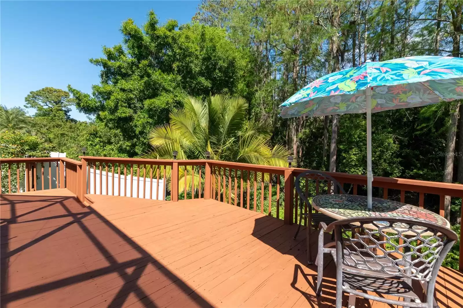 Wooden deck beyond the screened lanai