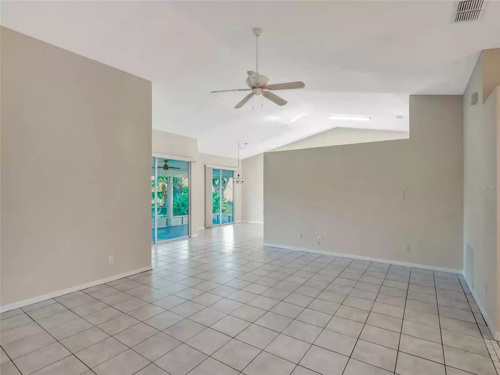 Living room looking towards dining room and back patio