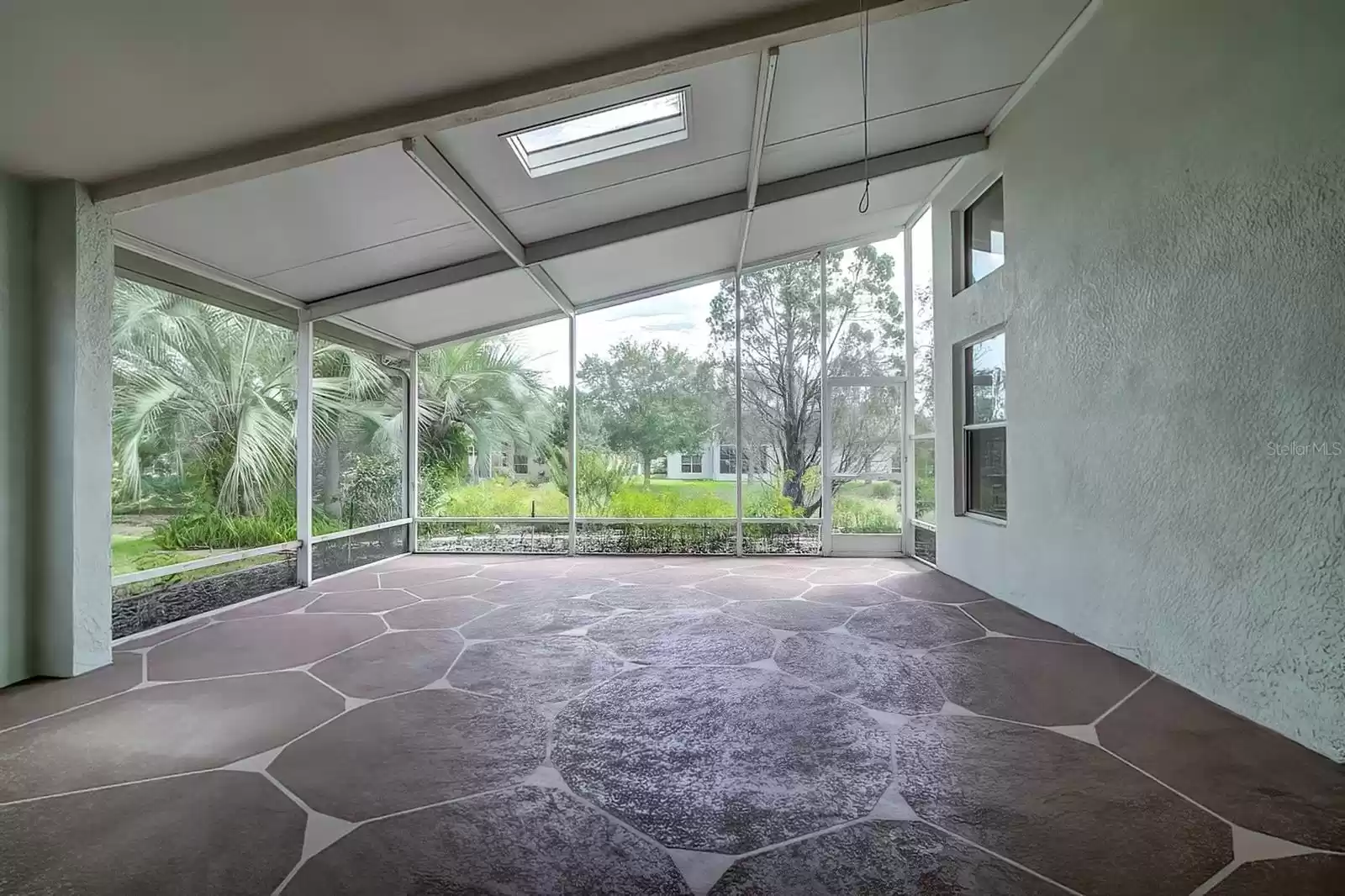 Screened-in patio with sky light