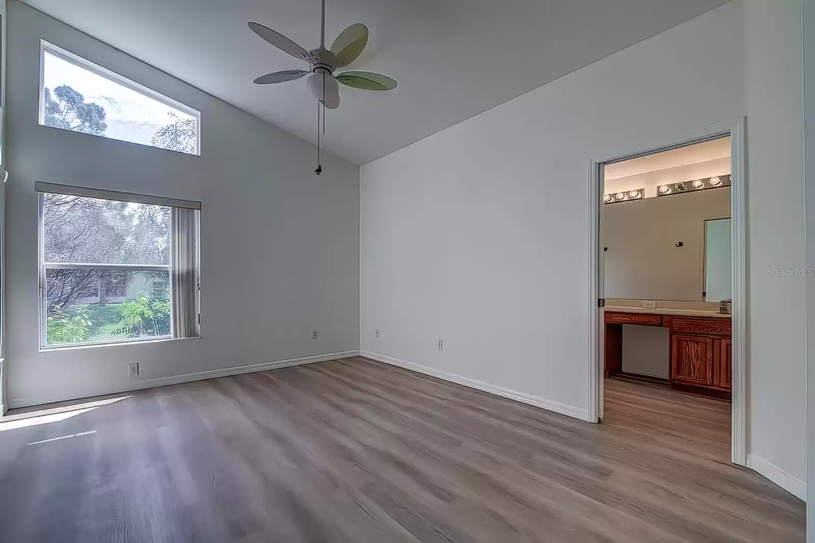 Primary Bedroom with En Suite, Vaulted Ceiling, Transom Window