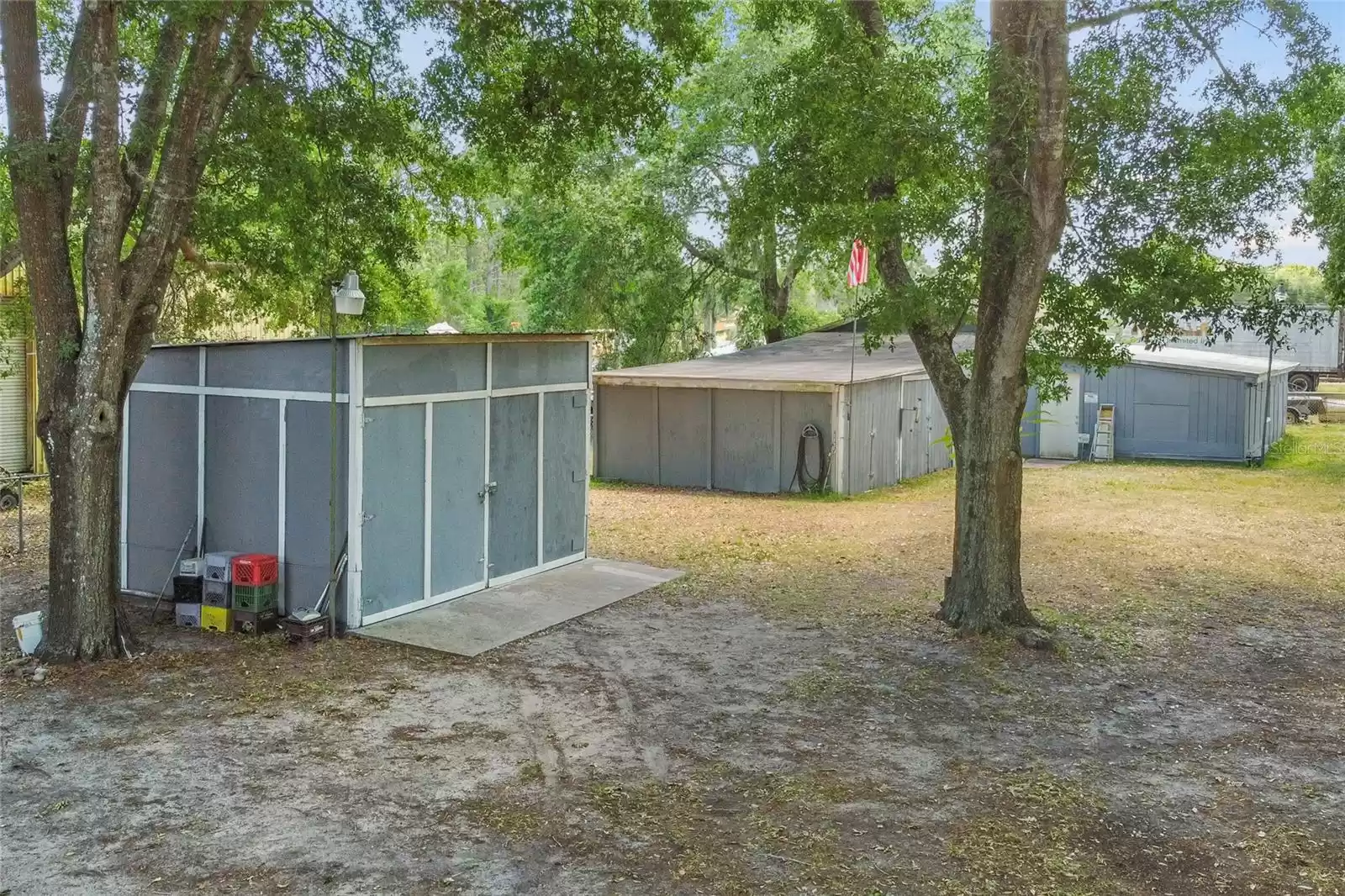 Wood Shop in front with Barn/Storage buildings