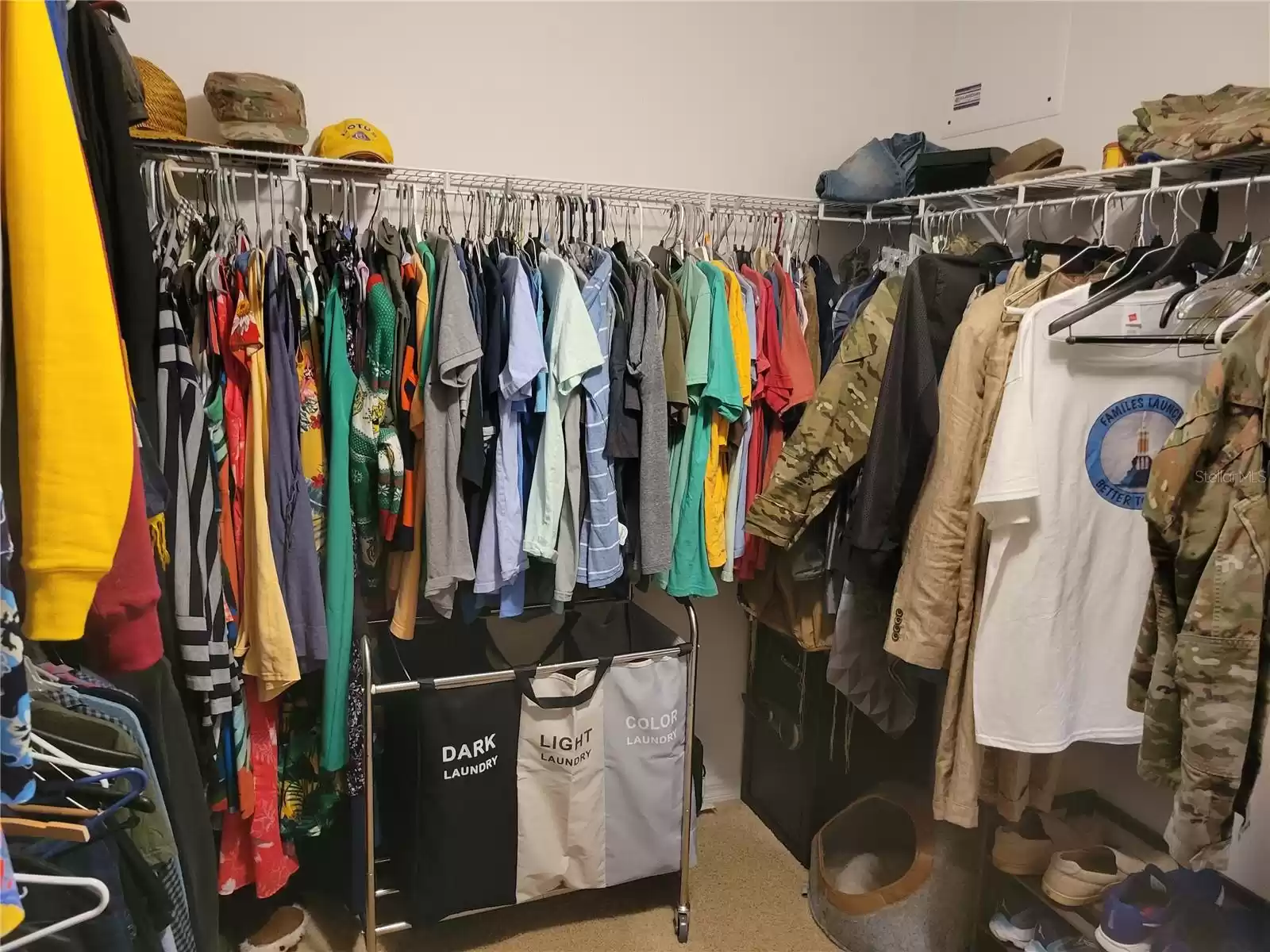 Primary bedroom walk-in closet