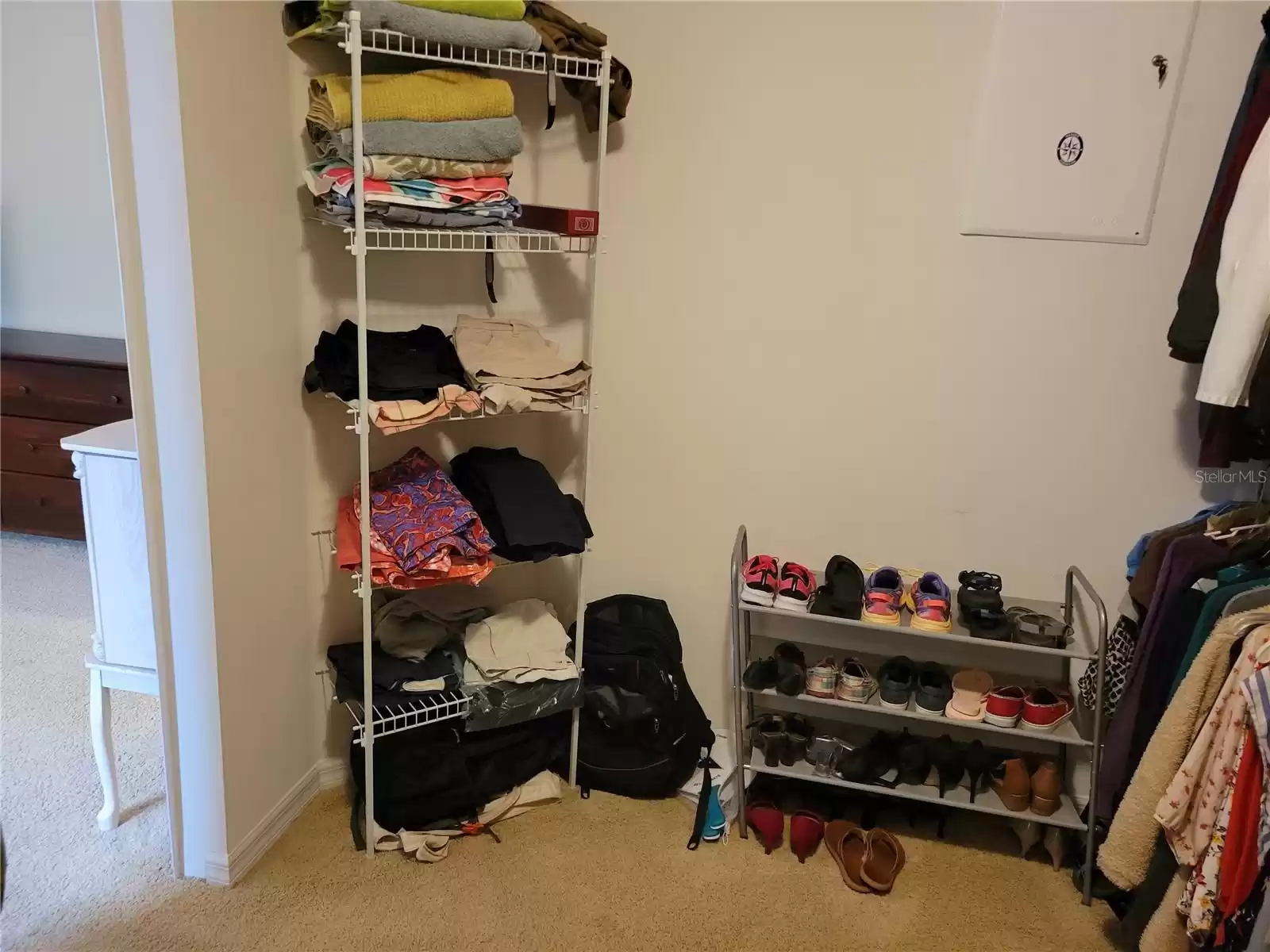 Primary bedroom walk-in closet