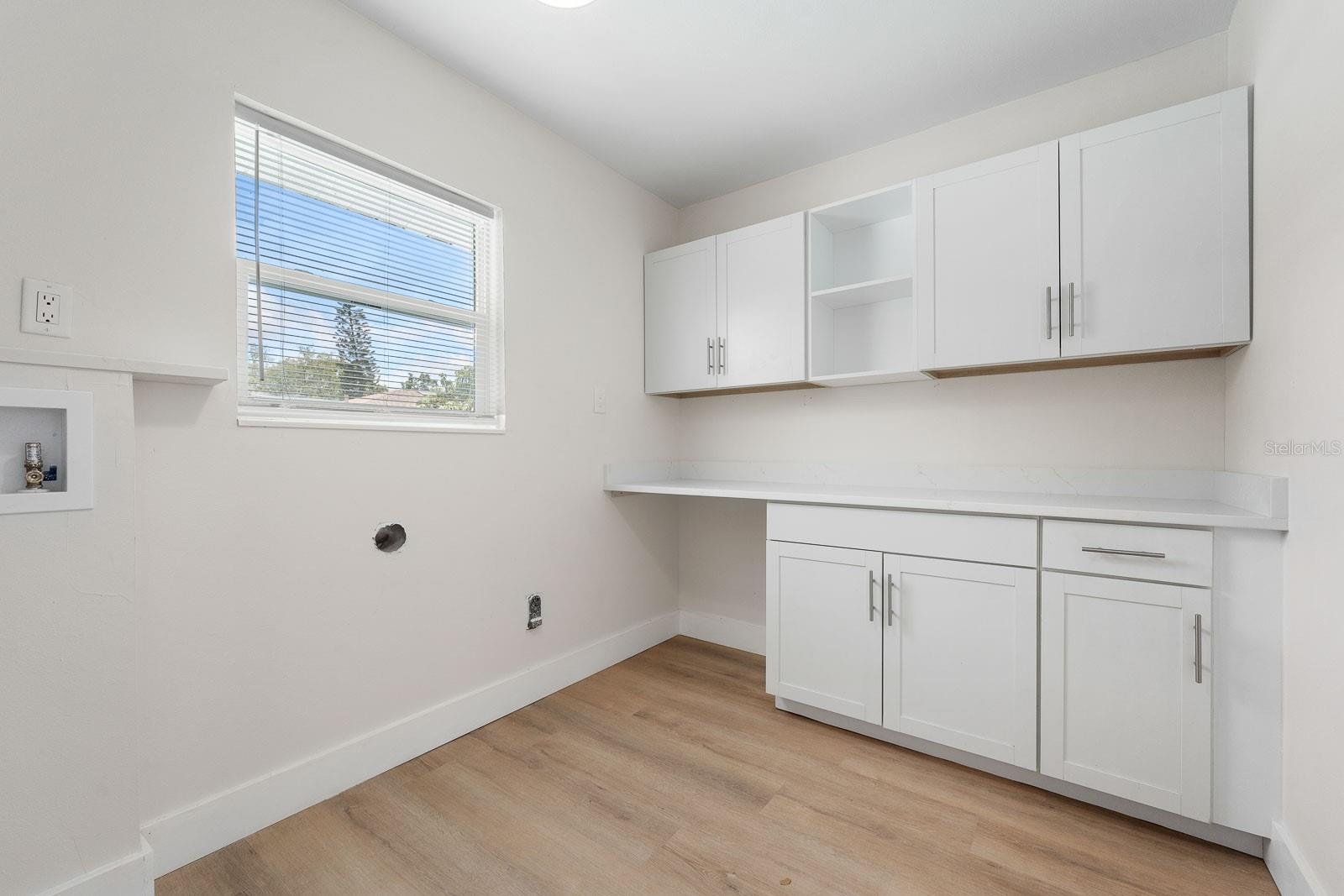 Inside Laundry Room with Work Top, Windows