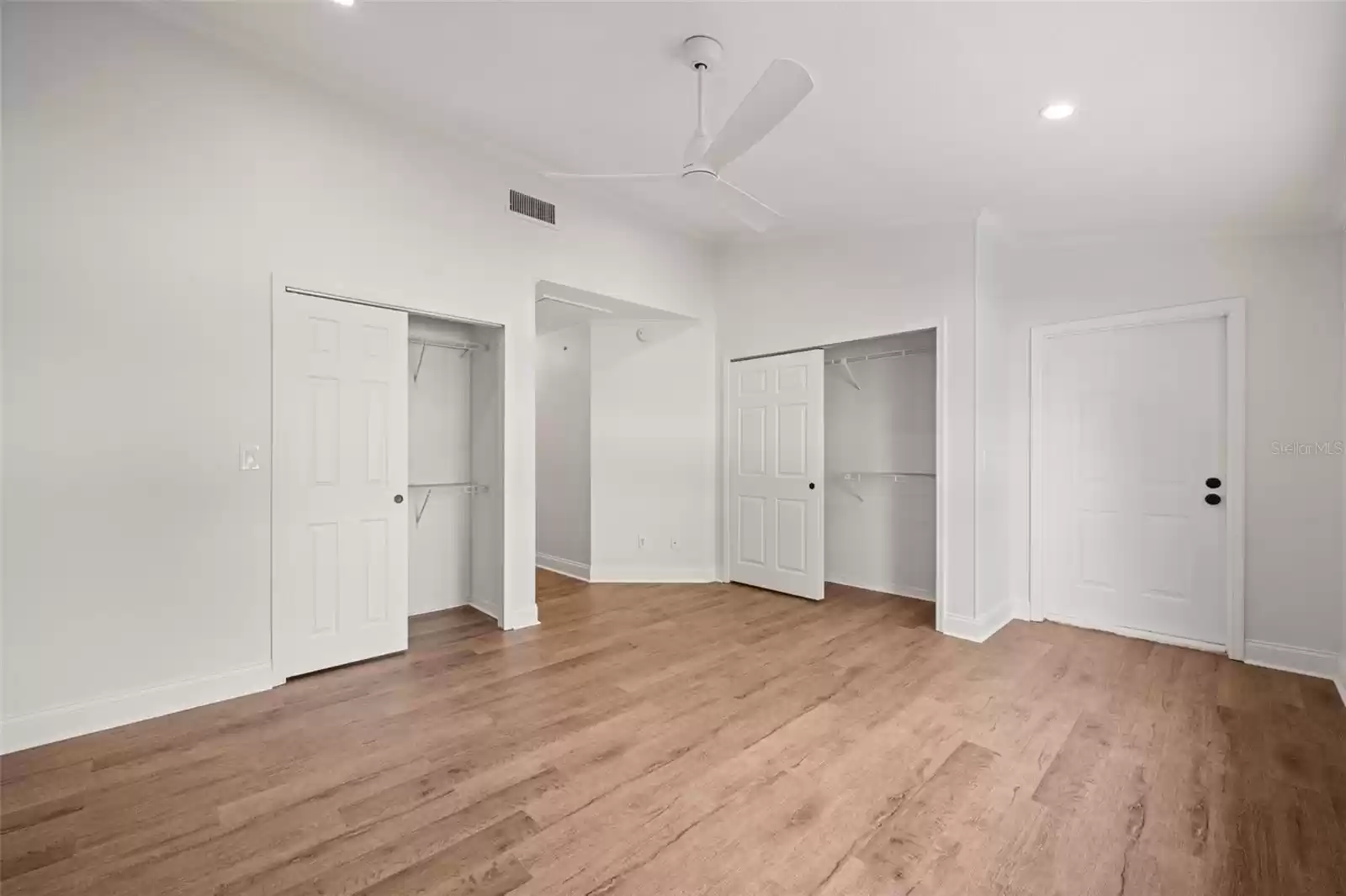 Primary Bedroom has 2 closets and a door to the screened in balcony