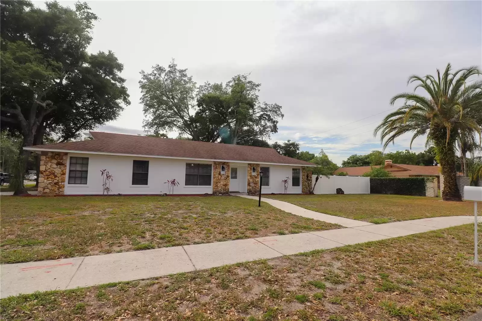 Front view of the nicely landscaped home.