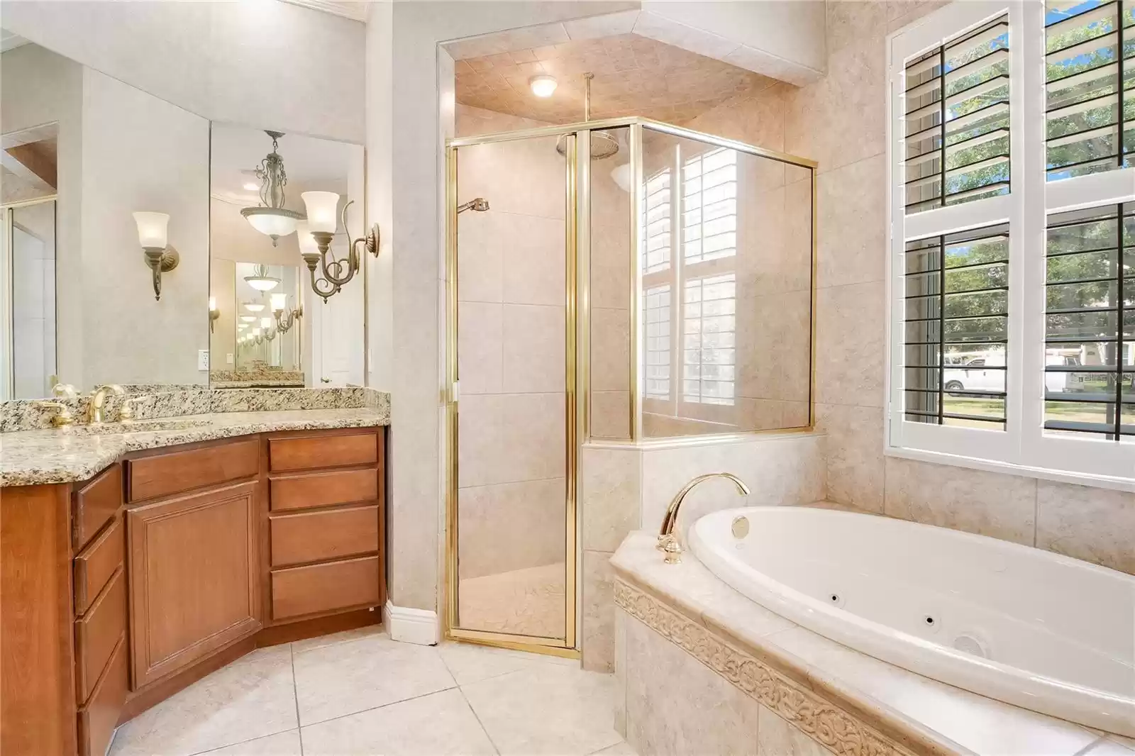 Separate dual sink vanities with TV built into the mirror.